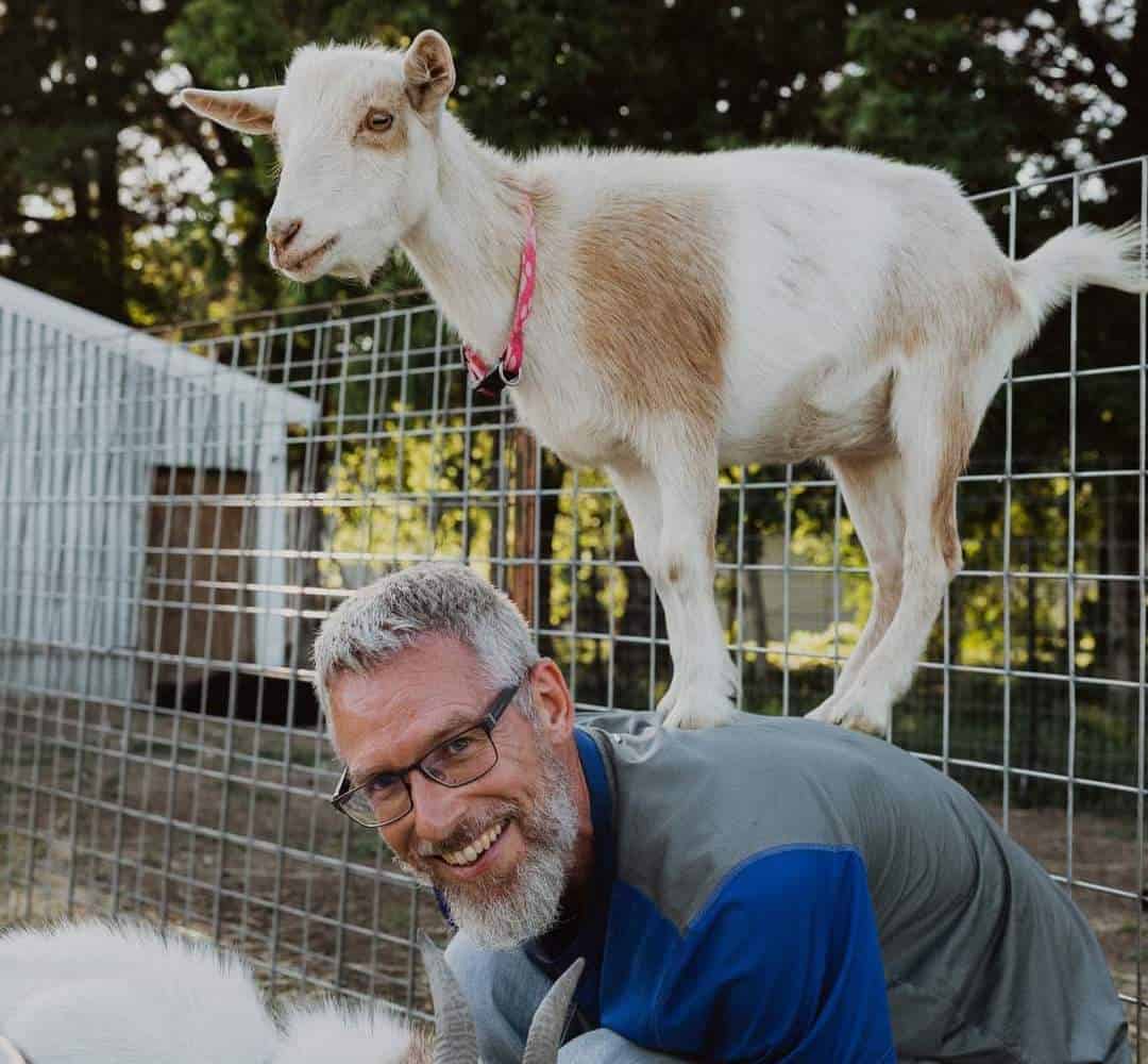 Jeffrey Penner with a goat on his back